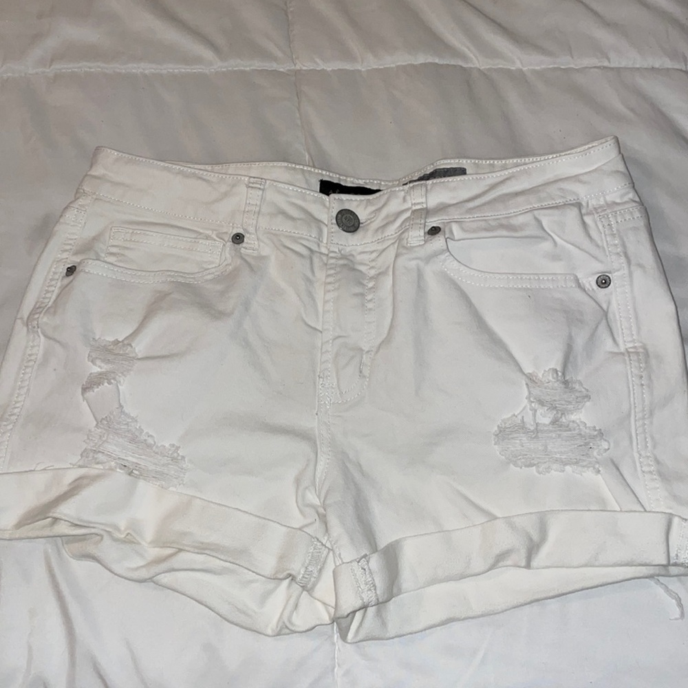 white ripped jean shorts
